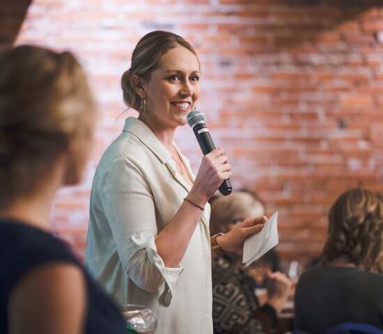 Woman speaking at Women & Bubbles Event at Ginger And Baker's Milltop Events Space