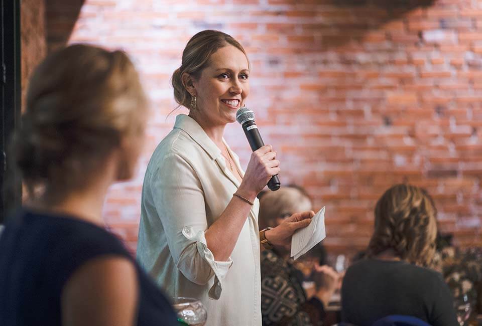 Woman speaking at Women & Bubbles Event at Ginger And Baker's Milltop Events Space