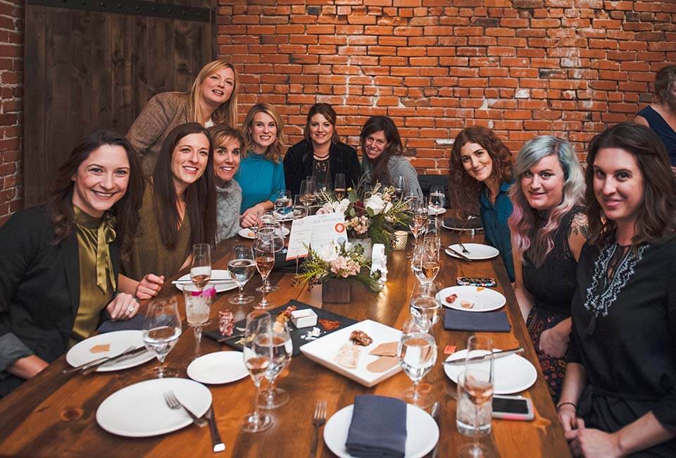 Women celebrating in the Ginger and Baker Milltop Events Space in Fort Collins