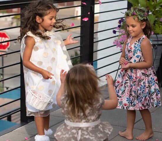Cute kids throwing flowers at a Wedding at Ginger and Baker