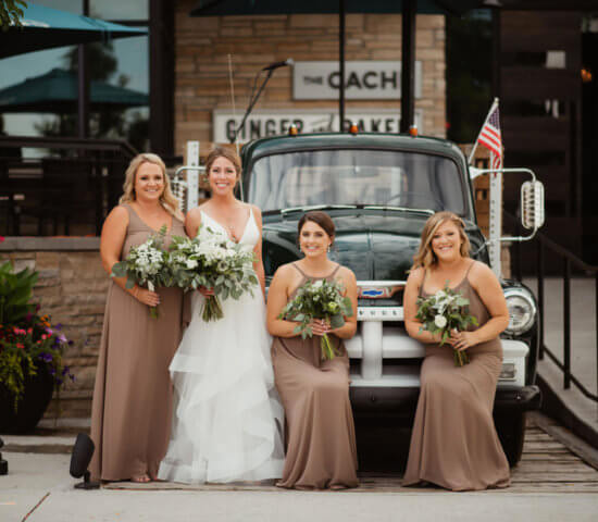 Bride and bridesmaids with vintage truck at Ginger and Baker in Fort Collins Weddings and Events