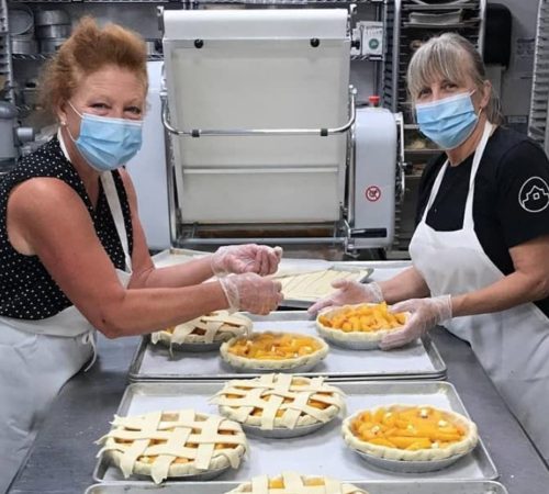 Ginger Graham and Chef Deb Traylor making pies for Fort Collins Rotary Fundraiser