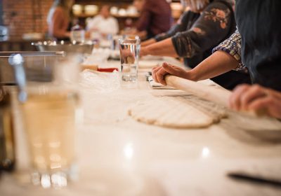 Rolling dough in a baking class at Ginger and Baker Teaching Kitchen in Fort Collins